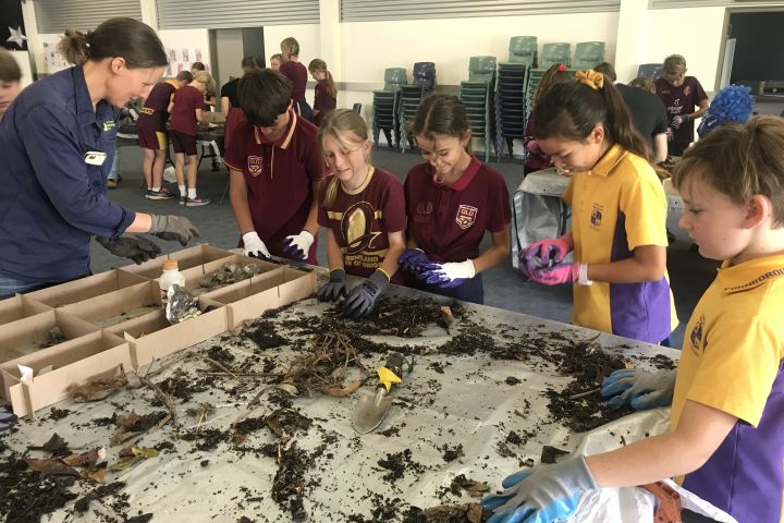 Students sift through debris caught by drain filters. Credit: Fitzroy Basin Association