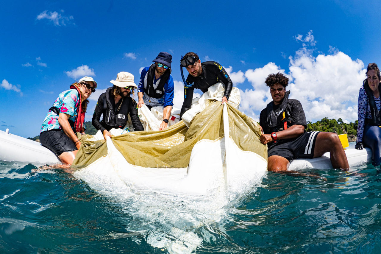 Traditional Owners in the Whitsundays deploying baby corals onto the Reef. Image credit: Jodi Salmond, Reef Check Australia