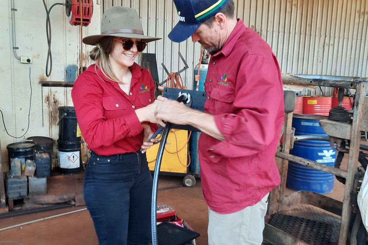 Farmacist employees Shannon Byrnes and Will Higham on site at local organic banana grower Ben Abbot's banana plantation.