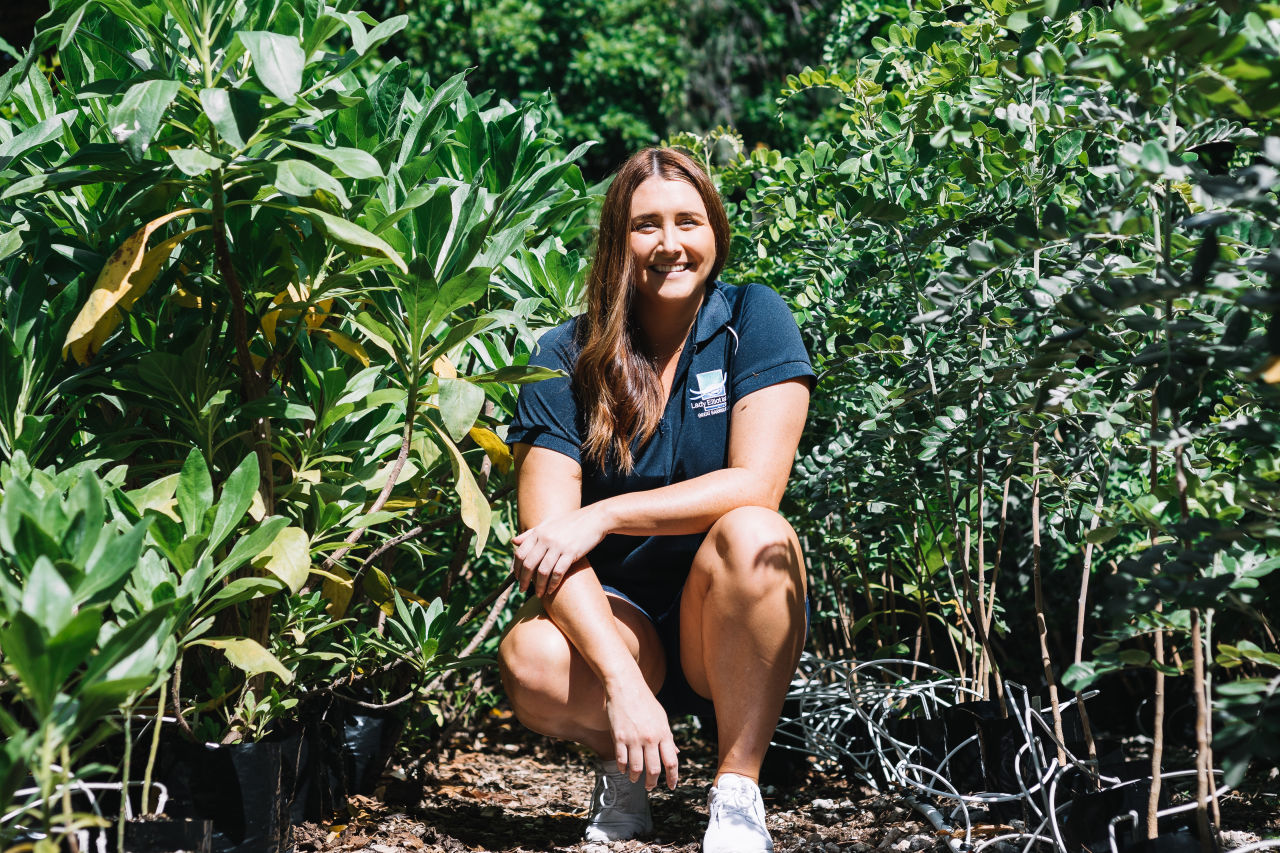 Amy in the island's nursery, which grows native species for the revegetation program. Supplied: Amy Gash