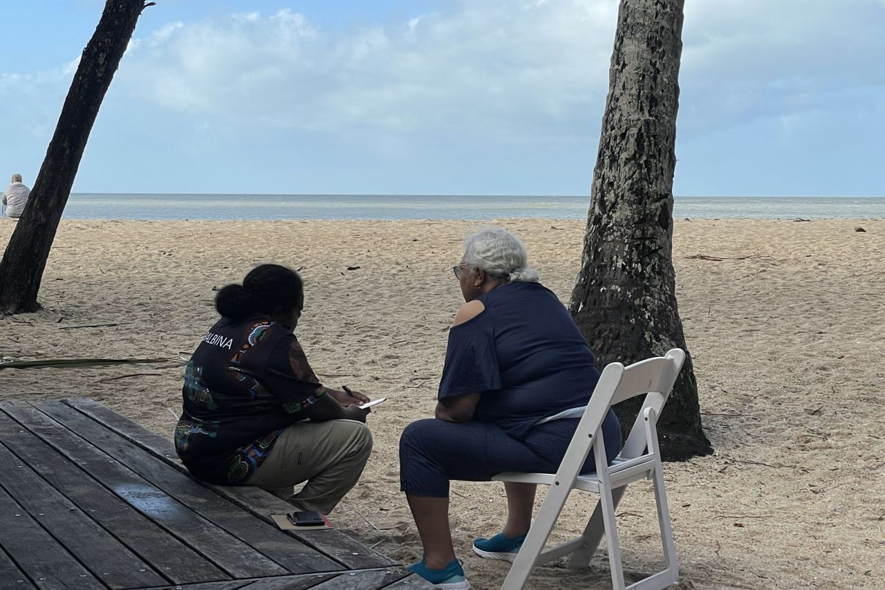 Anthea Solomon and Chrissy Grant (both Kuku Yalanji) work together to prepare messaging for a presentation as part of WomanSpeak held in May 2021.