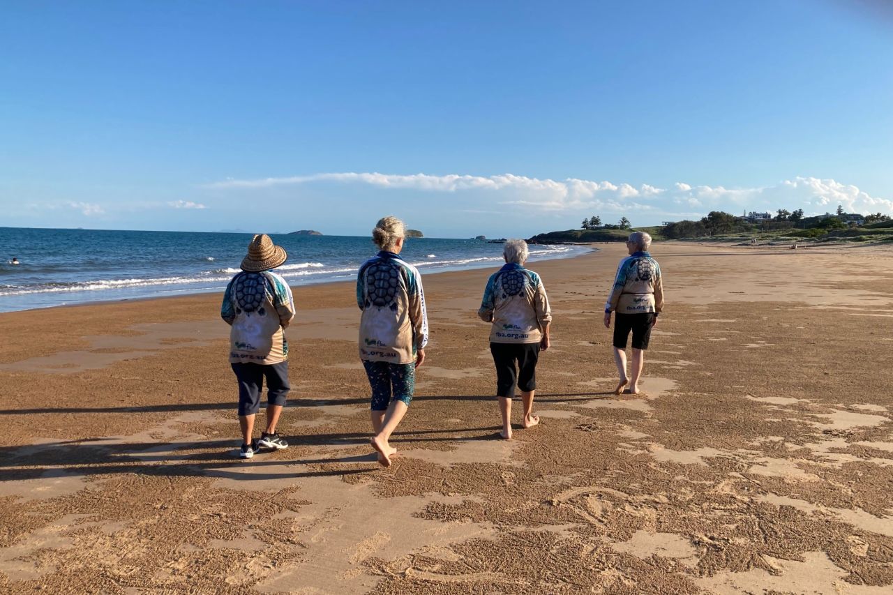 TTCQ volunteers walking beaches. Credit: FBA