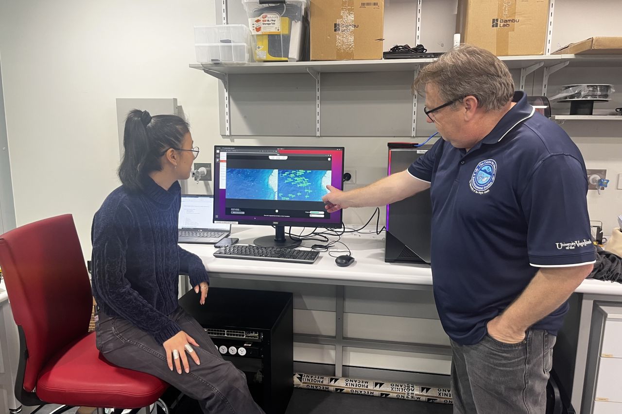 Project team members Professor Matthew Dunbabin and Serena Mou demonstrate the app