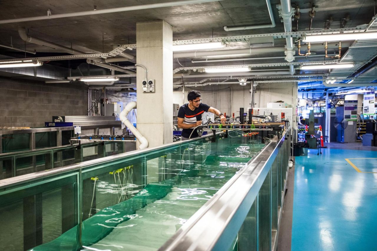 Rubble researchers at the University of Queensland's School of Civil Engineering use specially-designed tanks to measure the impact of waves of different types of reef rubble. Credit: University of Queensland 