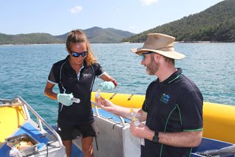 Tourism operators and scientists collecting water quality samples. Credit: Reef Catchments 