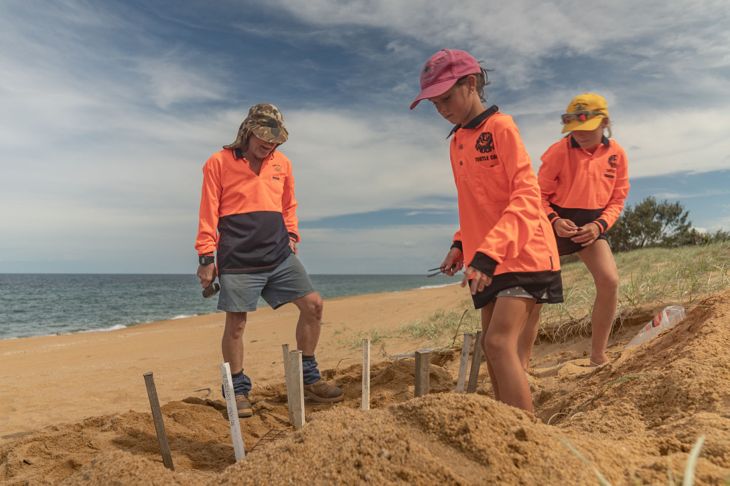 Nev and volunteers help cover nests with mesh. Credit Ben and Di.