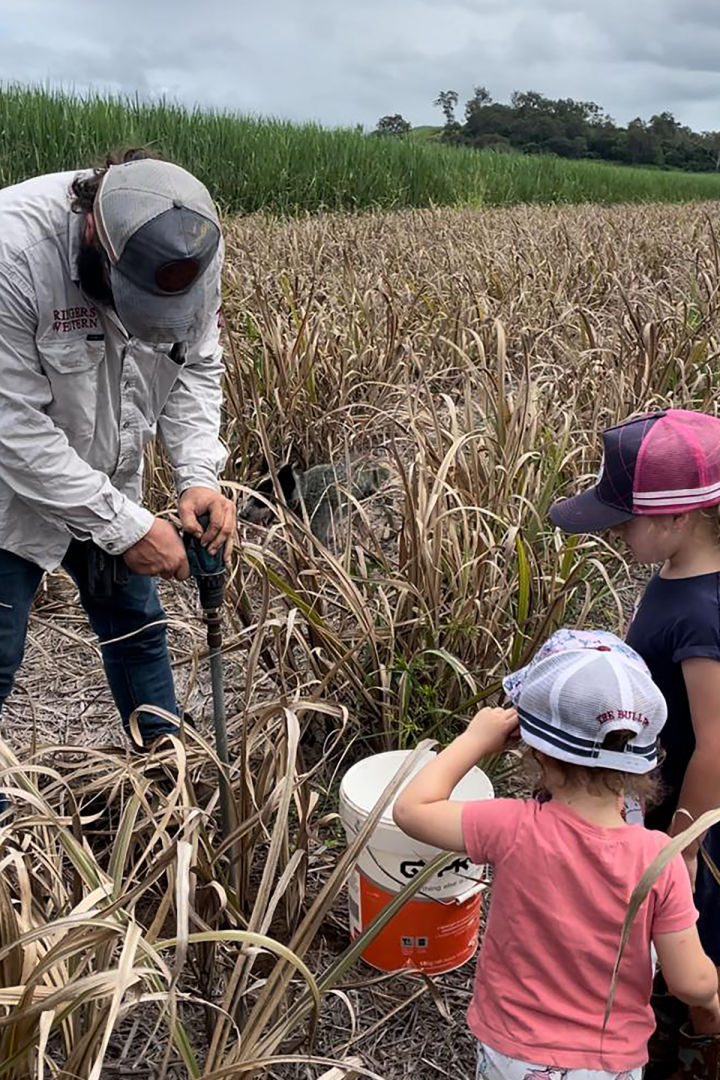 Matt Boyd getting some help sampling in the cane fallow on Moon Farming. Credit LiquaForce